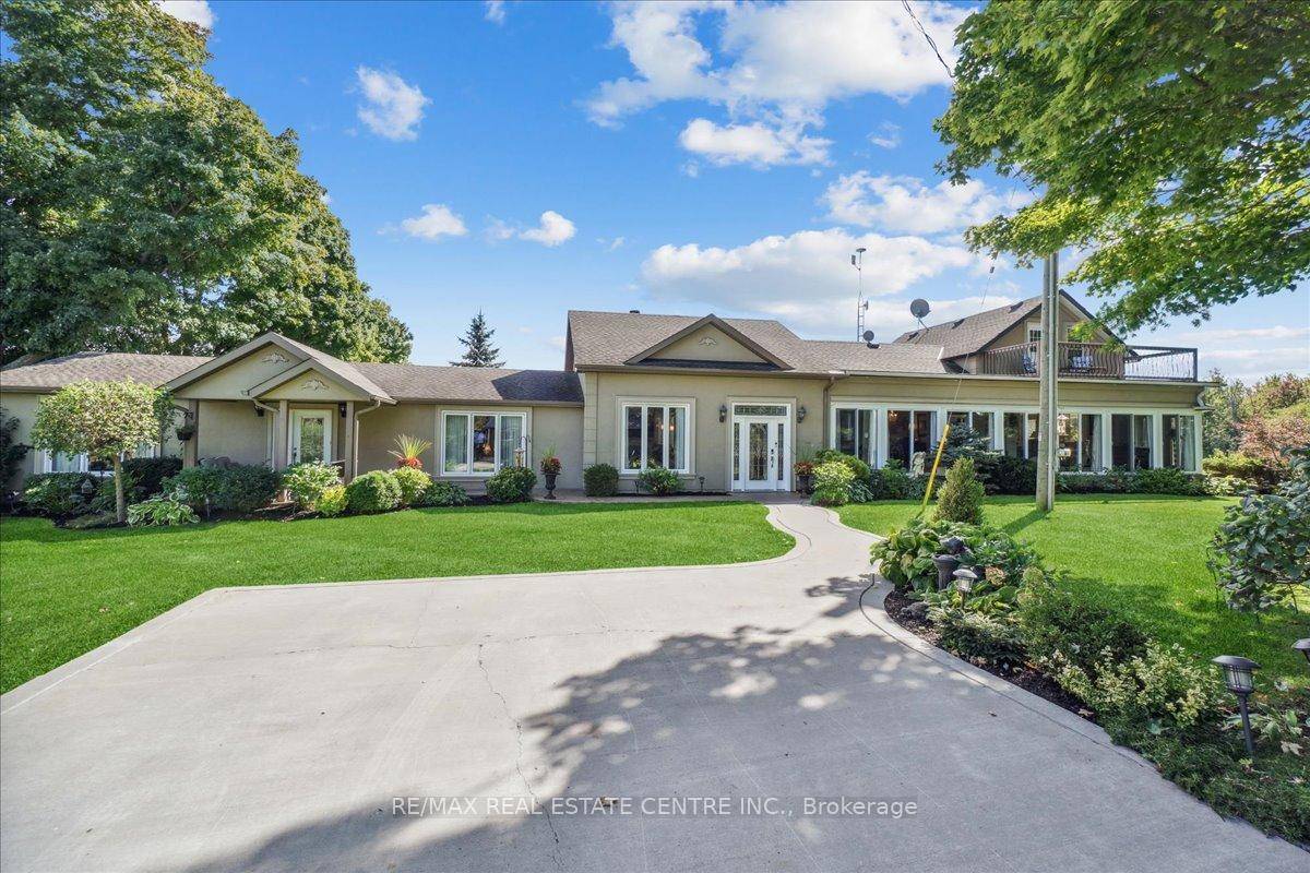 This Exceptional property offers a stunning 5 br home with an in law suite, two kitchens, two living rooms, a great room, and two laundry rooms.