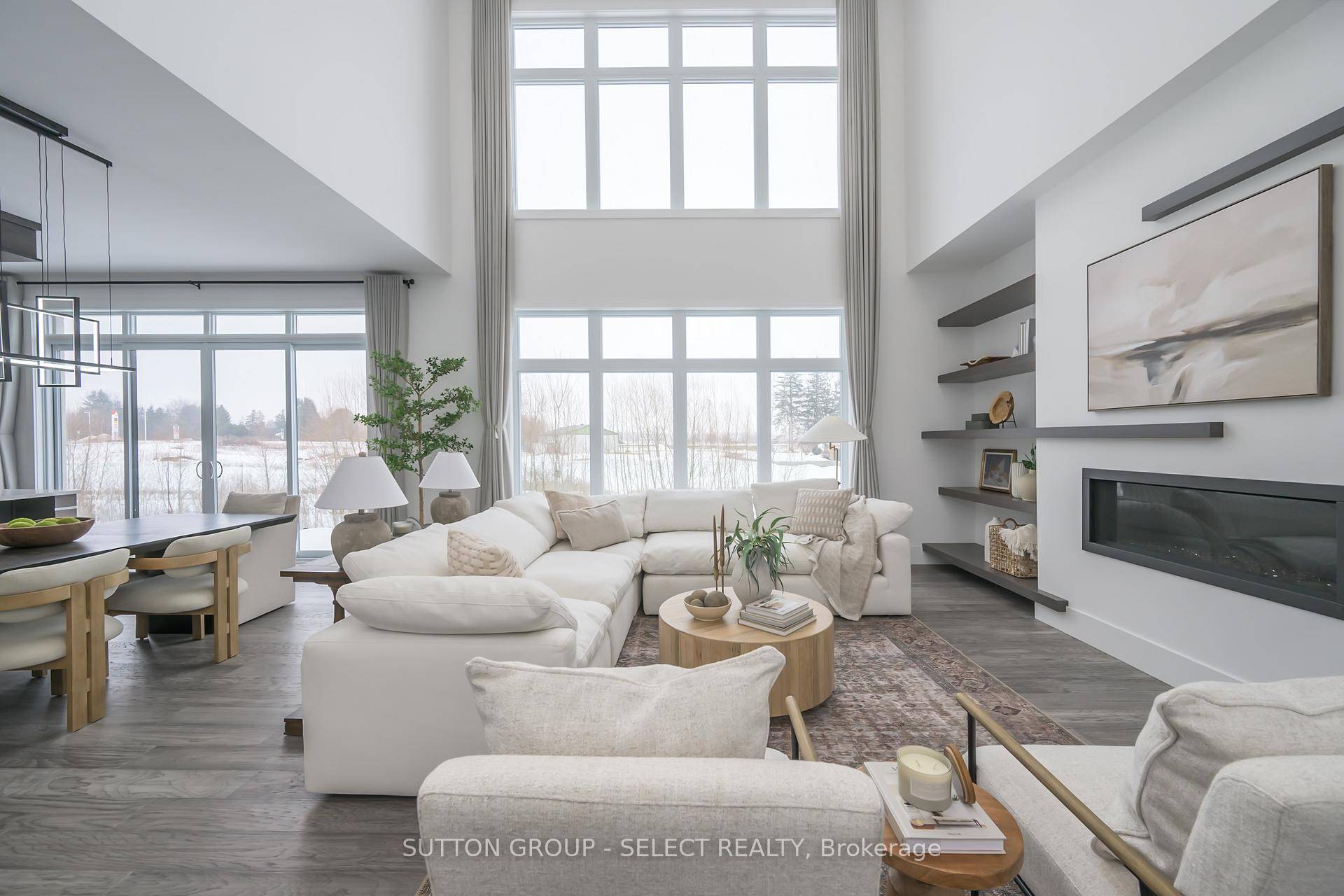 Striking modern residence on a premium lot backing onto protected green space and a picturesque stream offering rare privacy and natural serenity within the city.