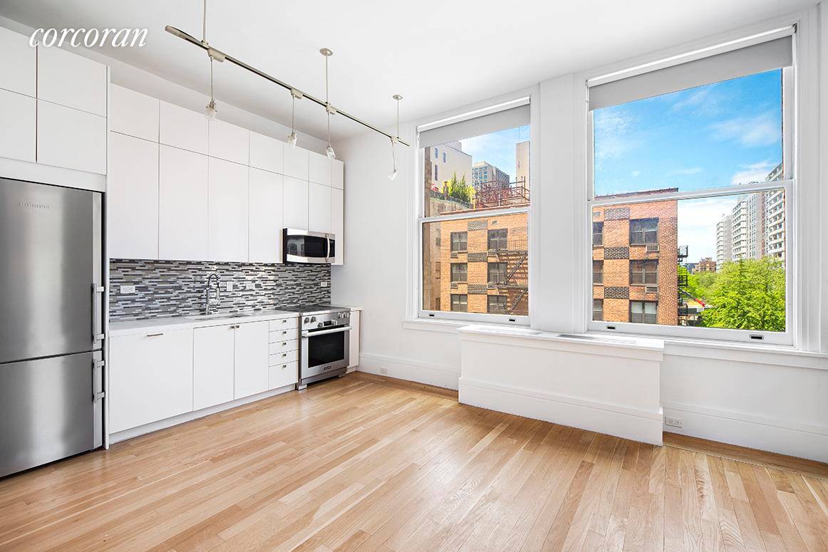 This NoHo 2 BR, 2 BA loft features exquisite renovations and timeless detail.