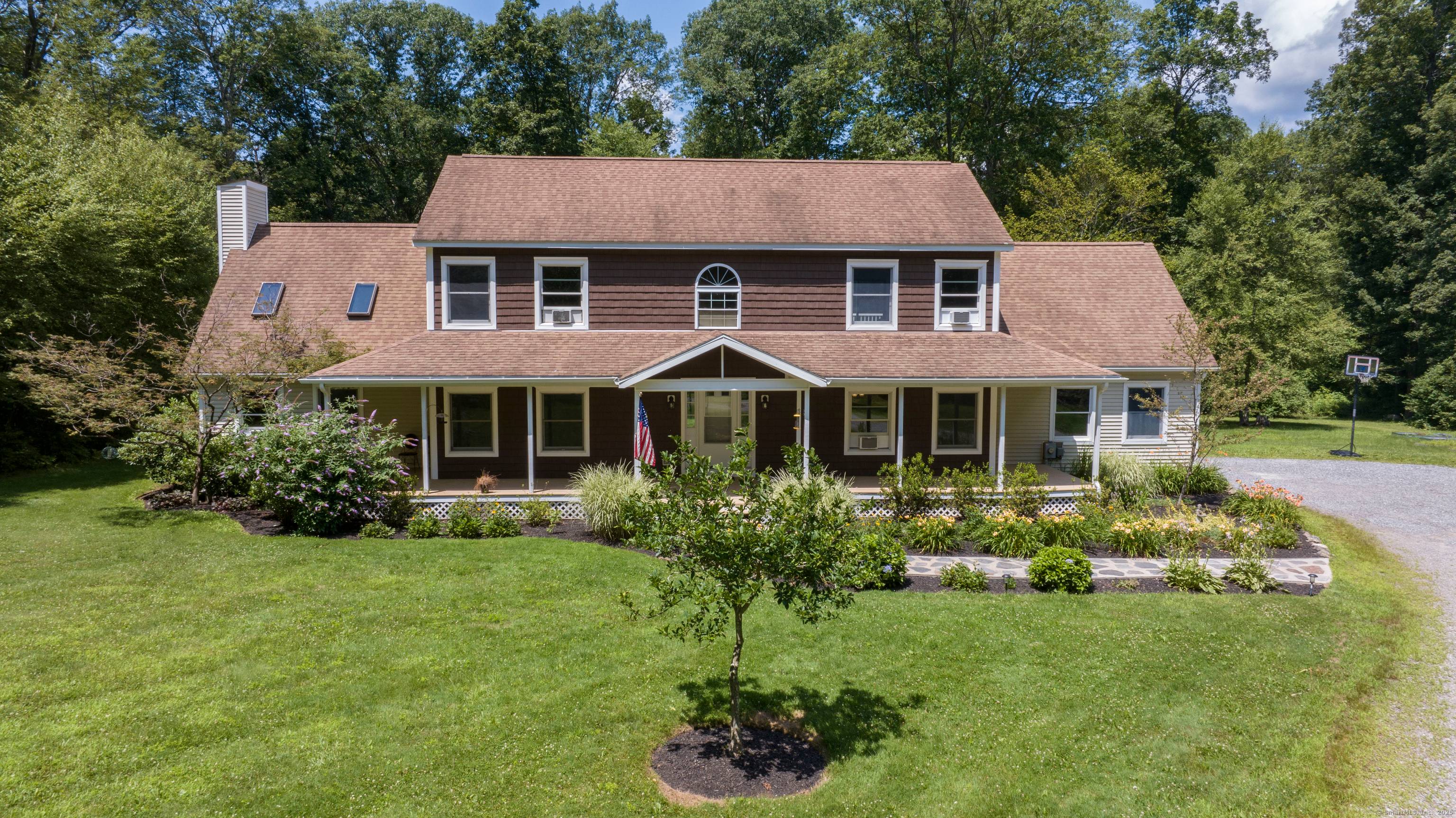 This beautiful sprawling custom colonial is set on 9 acres of land at the end of a winding long driveway and surrounded by open area.