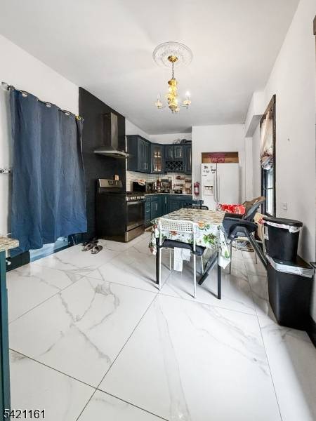 This is two family house with 1 bed, 1 bath in first floor and second floor has 5 bed, 1 full and 1 half bath.