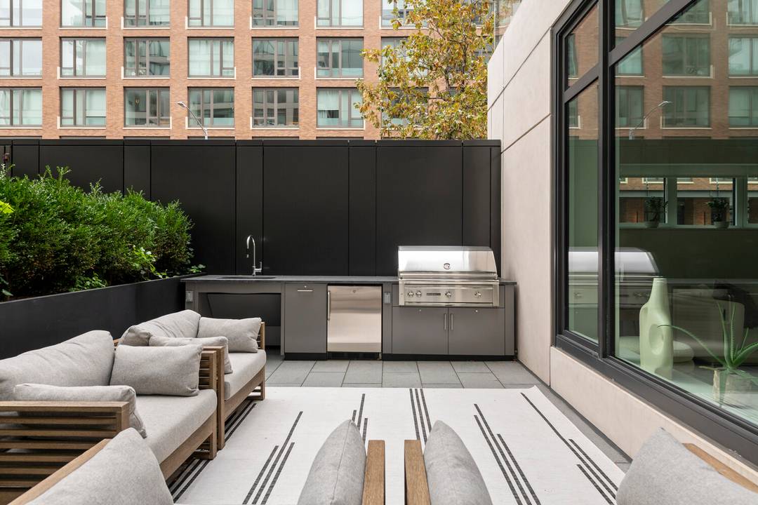 Set within one of Tribeca's most coveted waterfront enclaves, this rare townhouse style residence offers serene, private living just moments from Hudson River Park's leafy paths and sunset promenades.