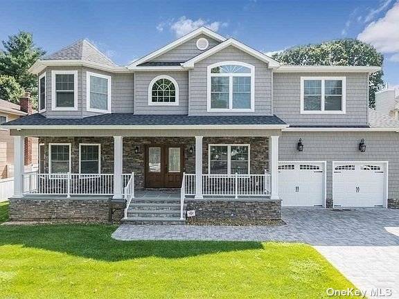 Step into luxury with this extraordinary custom built center hall colonial situated on an expansive, oversized property in the highly sought after Barnum Woods neighborhood.