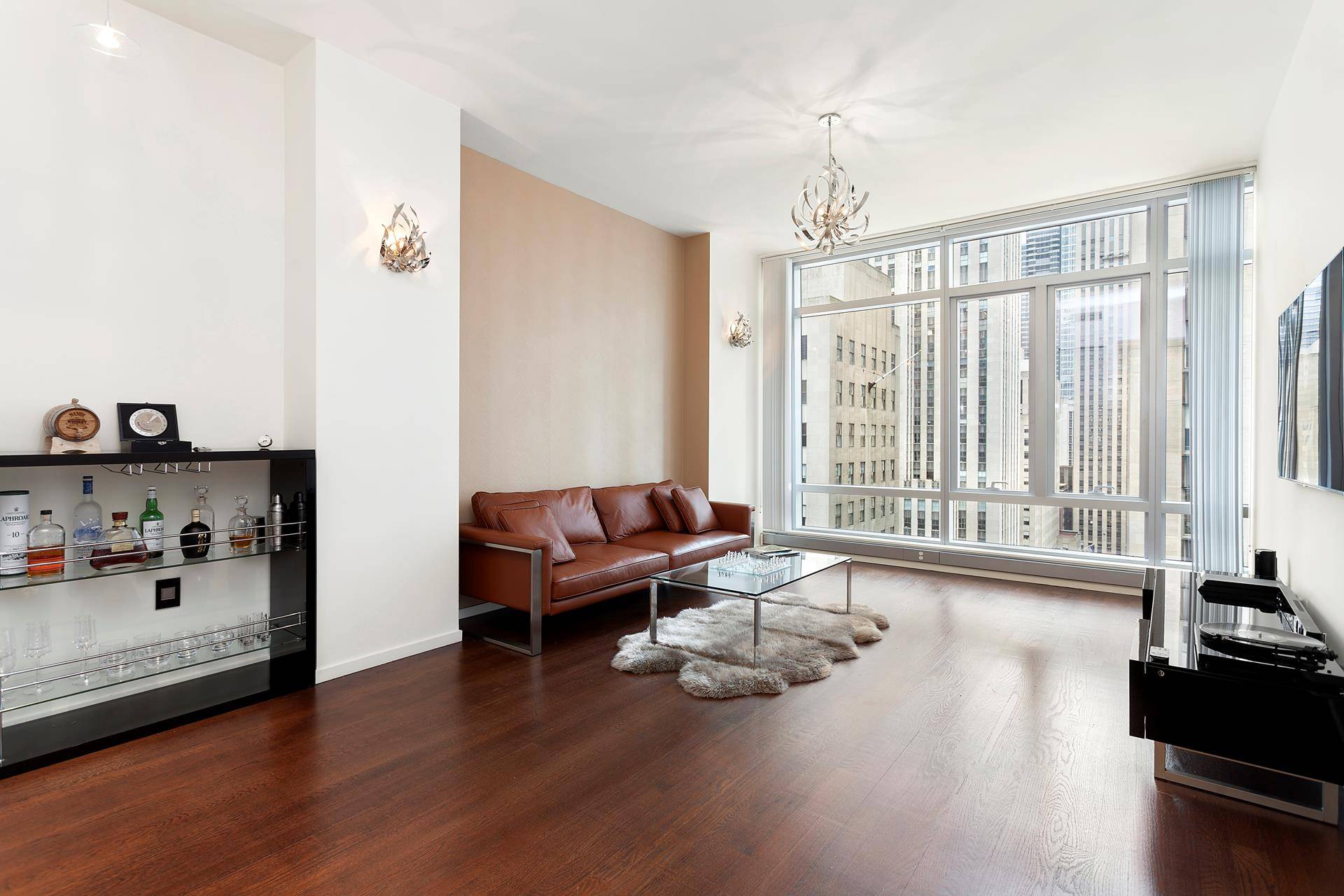 Look no further ! Enjoy direct BREATHTAKING VIEWS of Rockefeller Plaza from 10 ft floor to ceiling windows of this huge 1 bedroom 1.