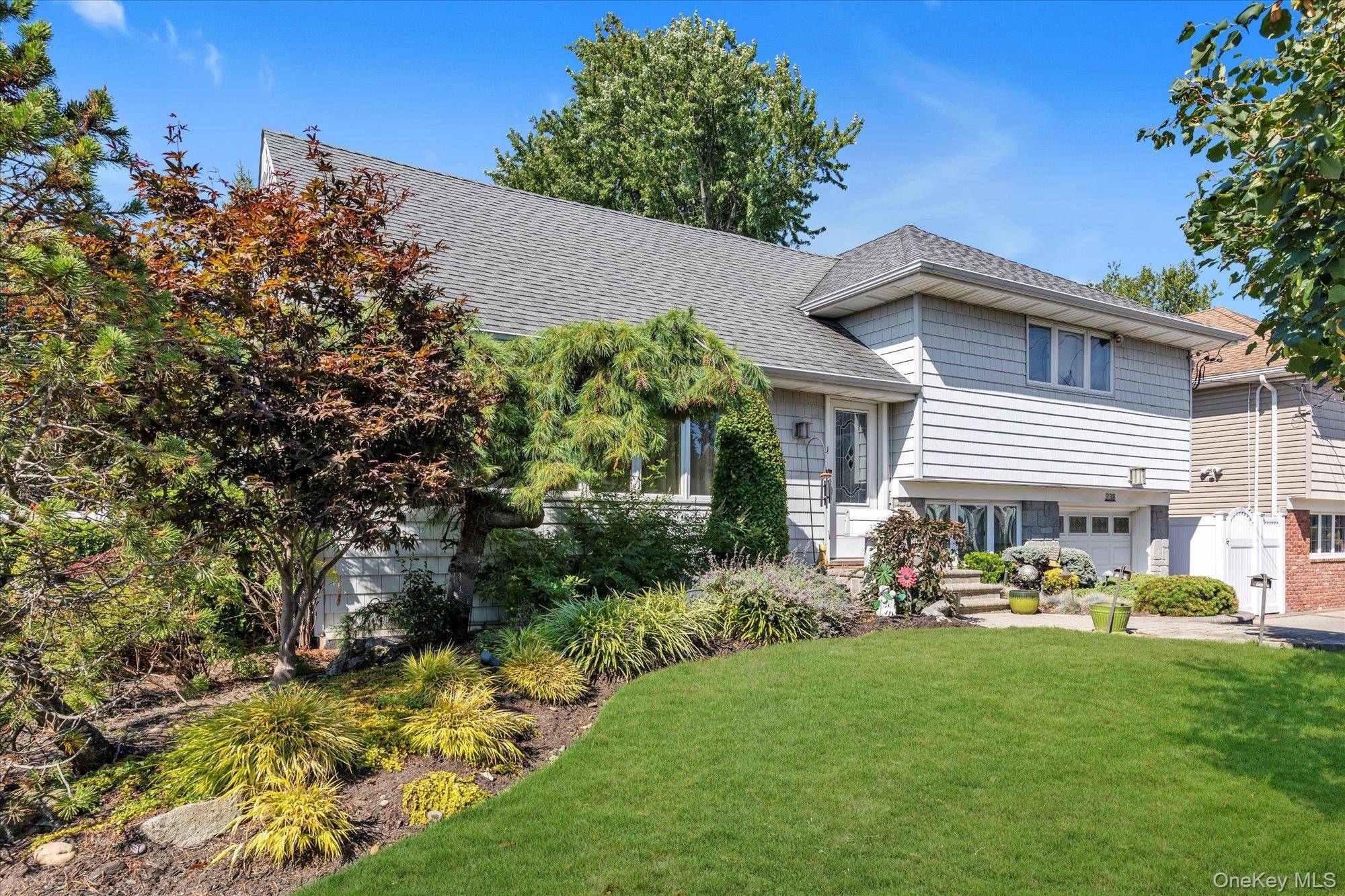 Step into this immaculate 3 bedroom, 2 bath split level residence of thoughtfully designed living space on a corner lot.
