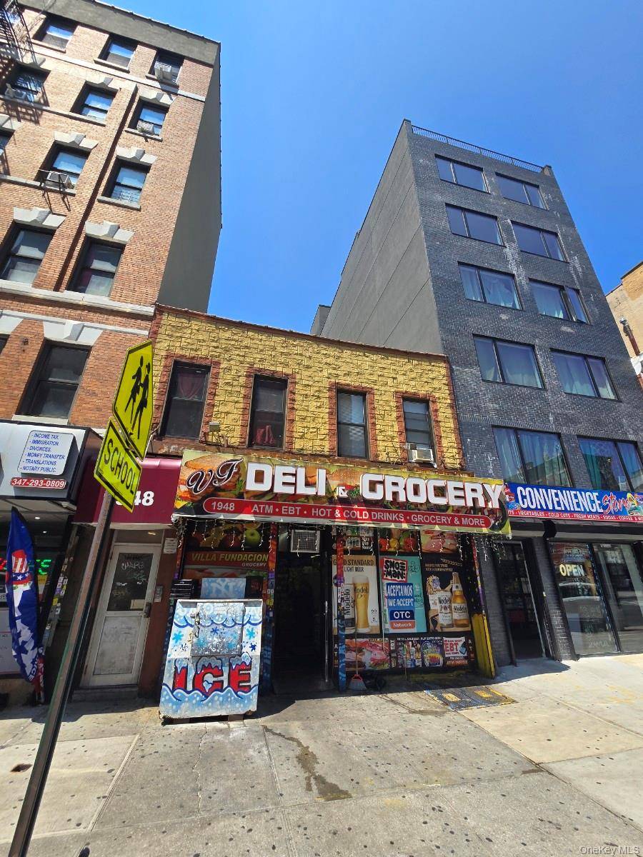 Two story mixed use building with ground floor retail 2 residential units above.