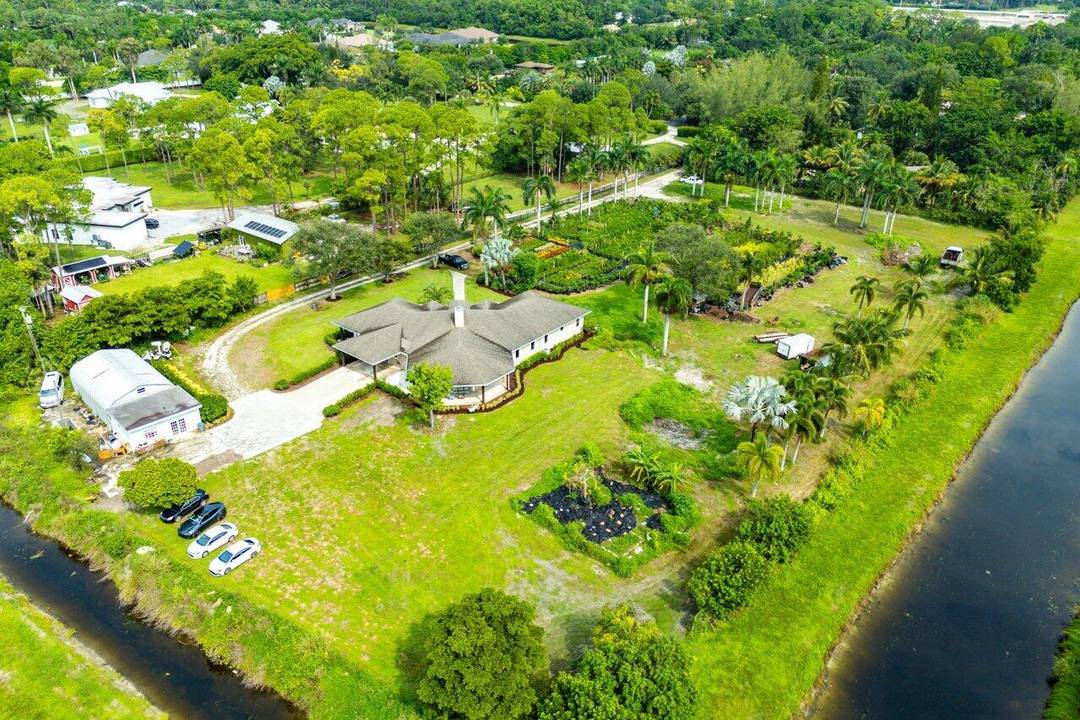 Tucked away at a dead end street with 3 acres of complete privacy, this home gives you the South Florida lifestyle you've dreamed of !