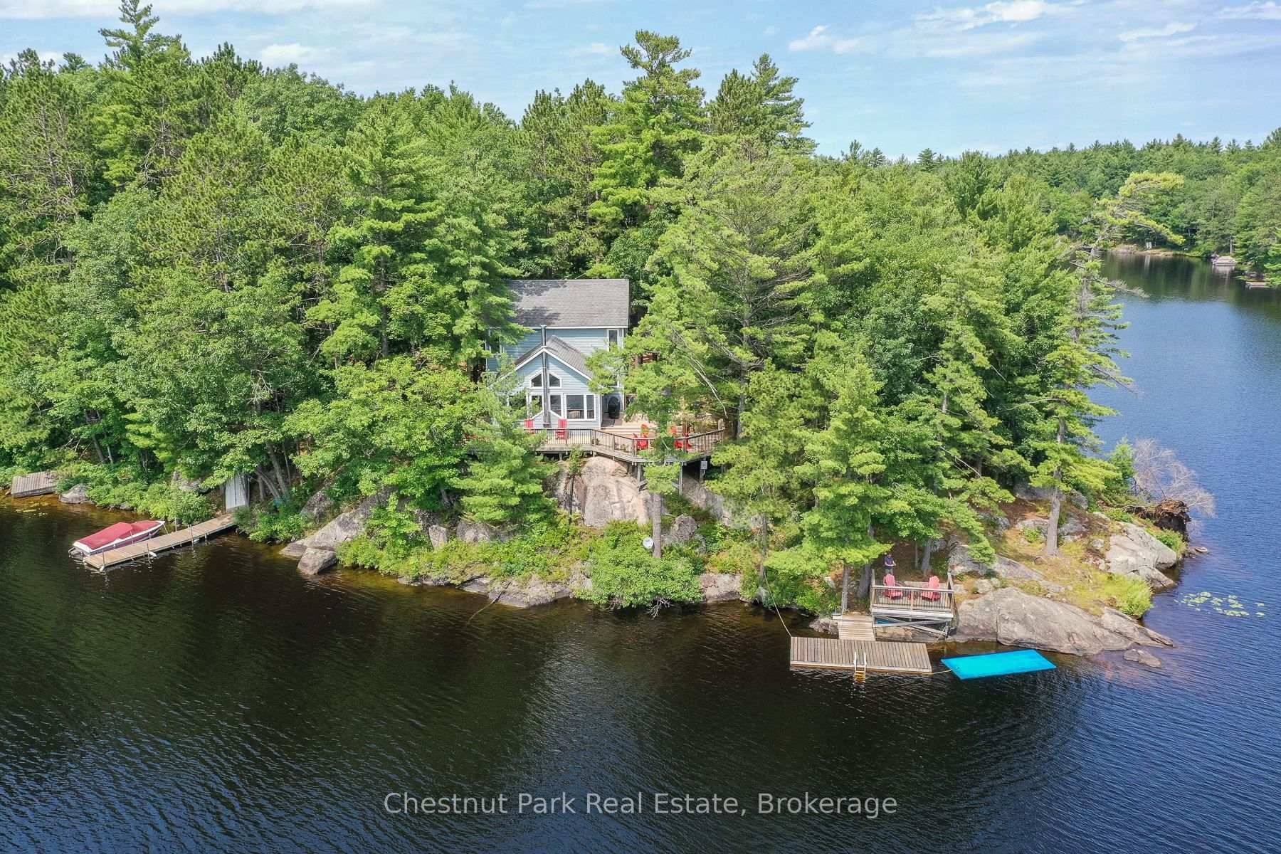 This spectacular property will take your breath away with it's unparalleled offering of 640' of waterfront privacy on Beautiful Kahshe lake.