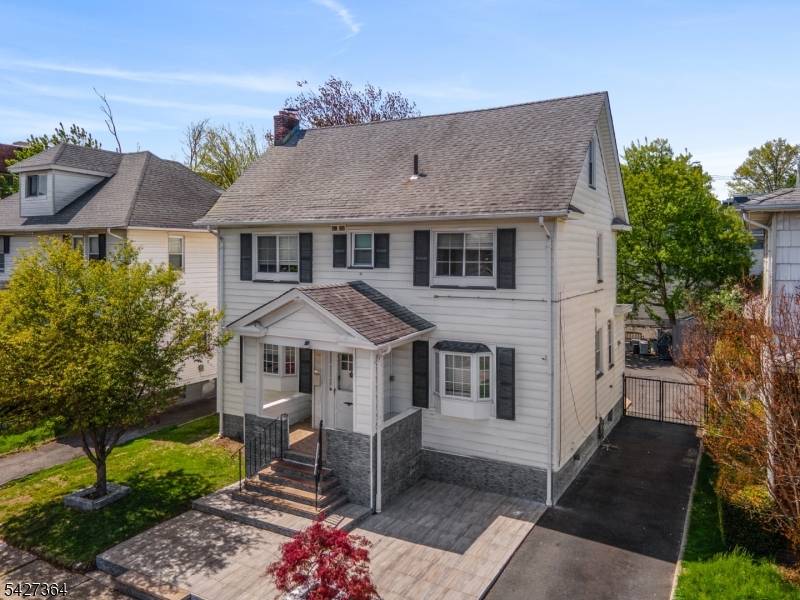 This spacious 5 bedroom home offers a versatile layout with a total of 4 baths, perfect for comfortable living and entertaining.