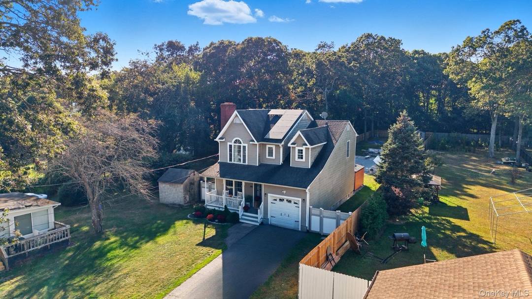 Welcome to this beautiful Colonial style home in the heart of Mastic Beach.