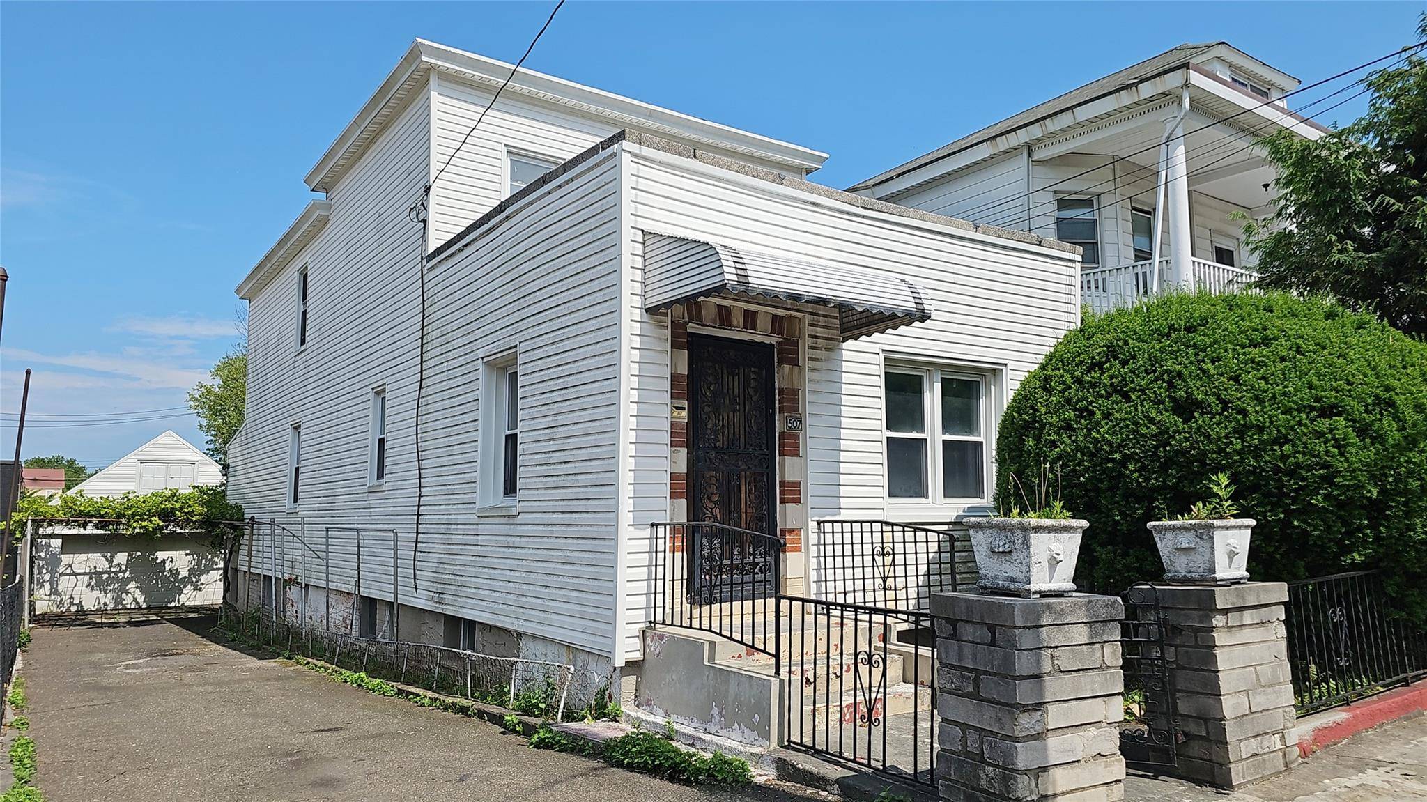 Larger legal two family dwelling with 2 car garage and sweet back yard just waiting for the right buyer.