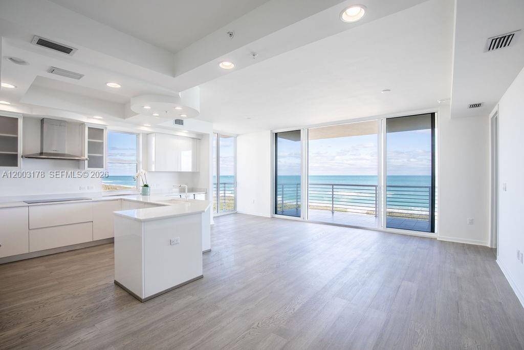 Step into this never lived in oceanfront haven, a canvas awaiting your personal touch.