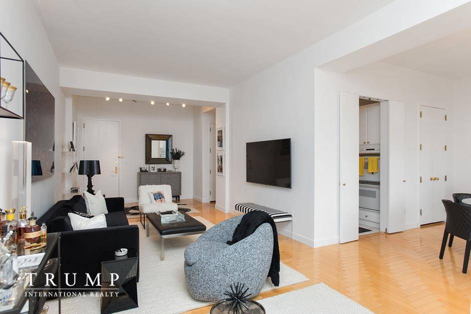 Rare opportunity to own a large one bedroom layout flexible two bedroom with L shaped Living Room Den at One Central Park West.