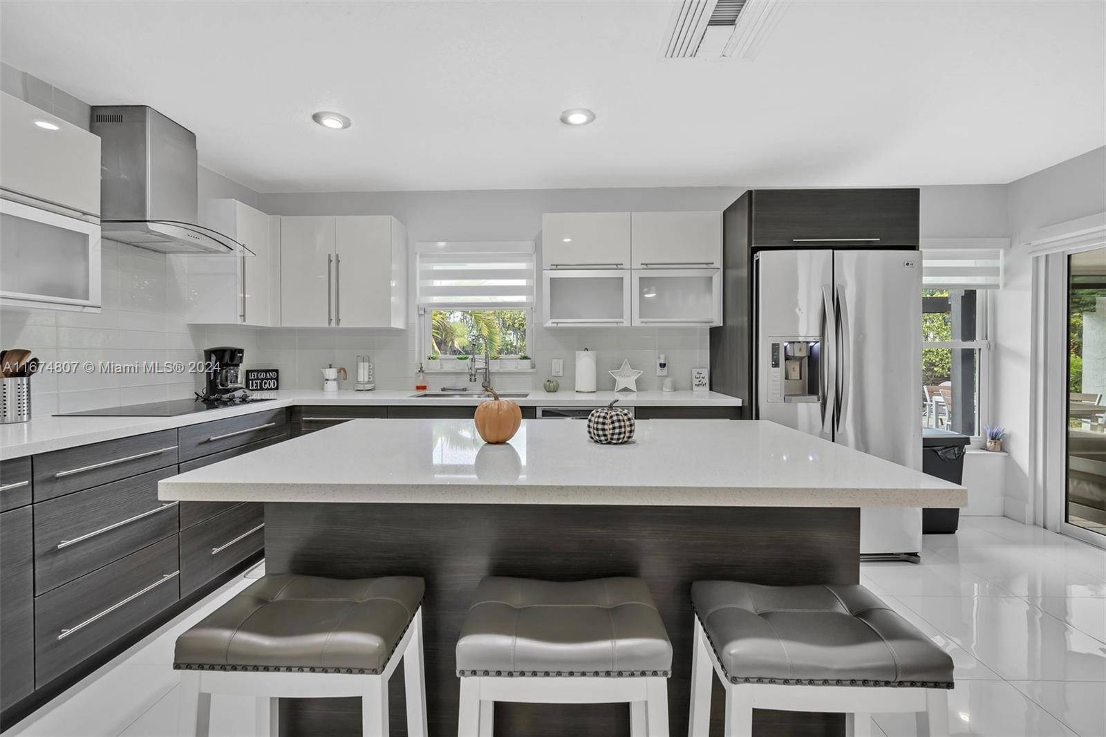 Discover your fully updated, modern, open concept dream home featuring impact windows and doors, new AC unit and 2017 roof.