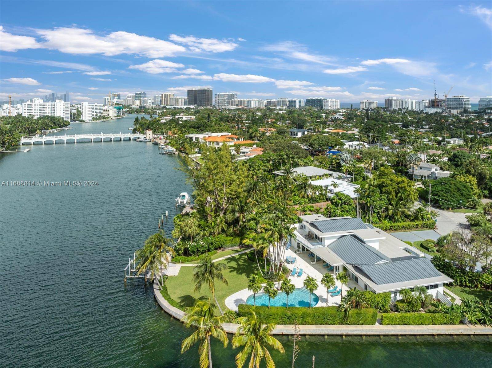 Experience the pinnacle of waterfront luxury at this extraordinary residence, perfectly situated on a prime corner lot with 240 feet of pristine waterfrontage.