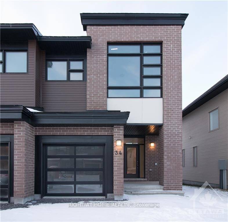 This beautifully maintained Urbandale Discovery model townhome features hardwood flooring throughout the open concept living and dining areas, with upgraded tile in the entryway and kitchen.
