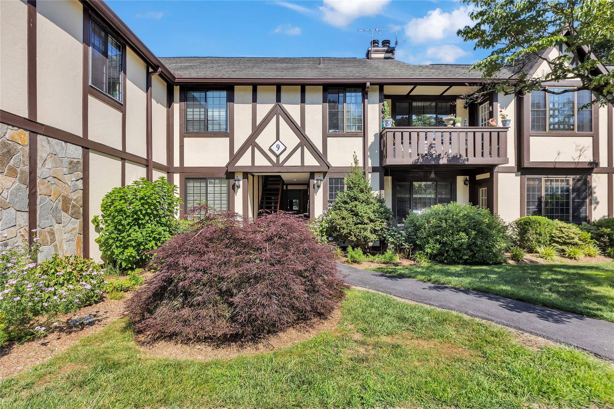 Sophistication meets comfort at this stunning Tudor style residence in the highly sought after Foxwood community.