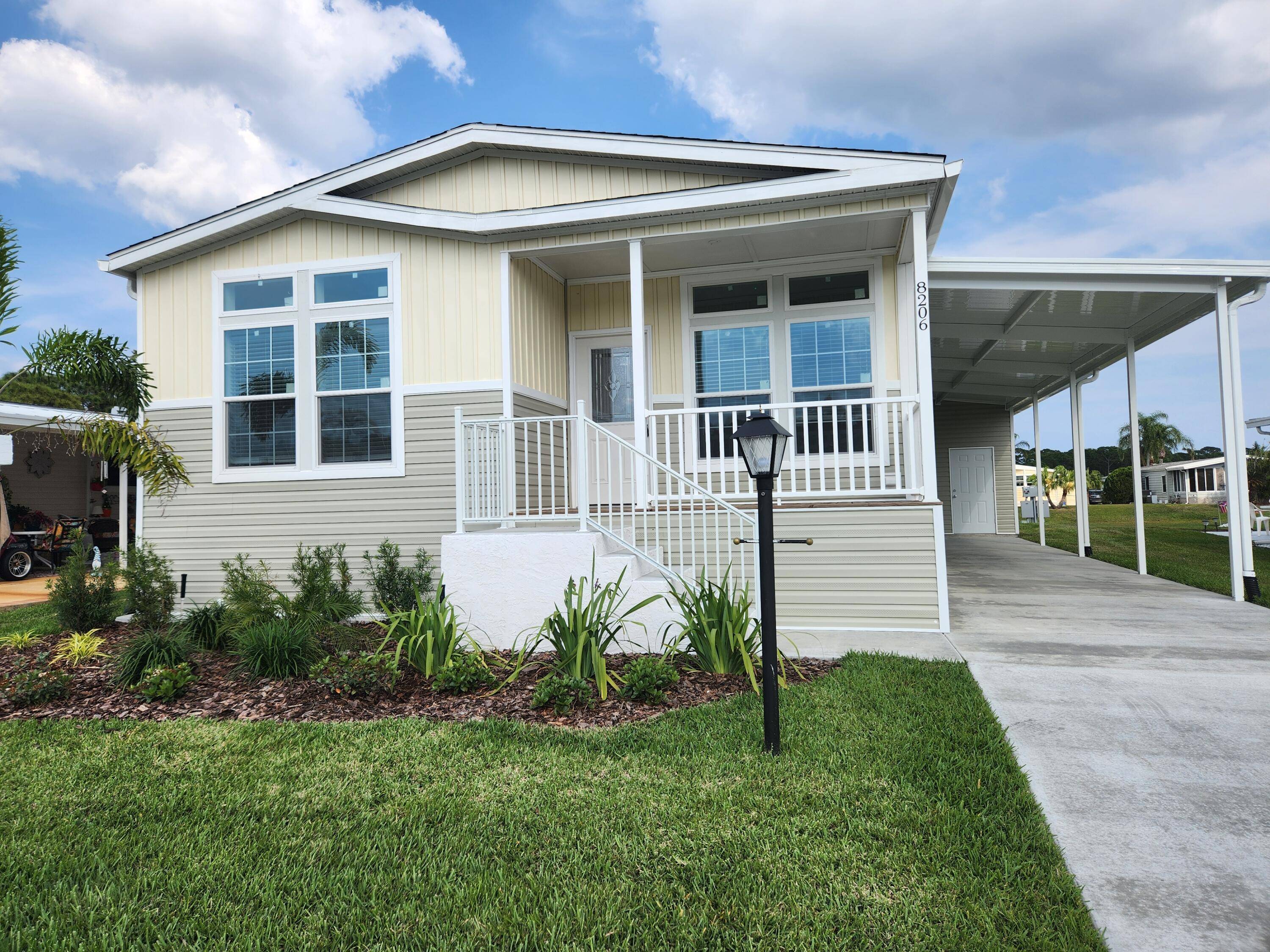 Savanna Club 55 Resort styled Golf Community offers this NEW 2 2 with Den on fabulous Waterfront Lot.