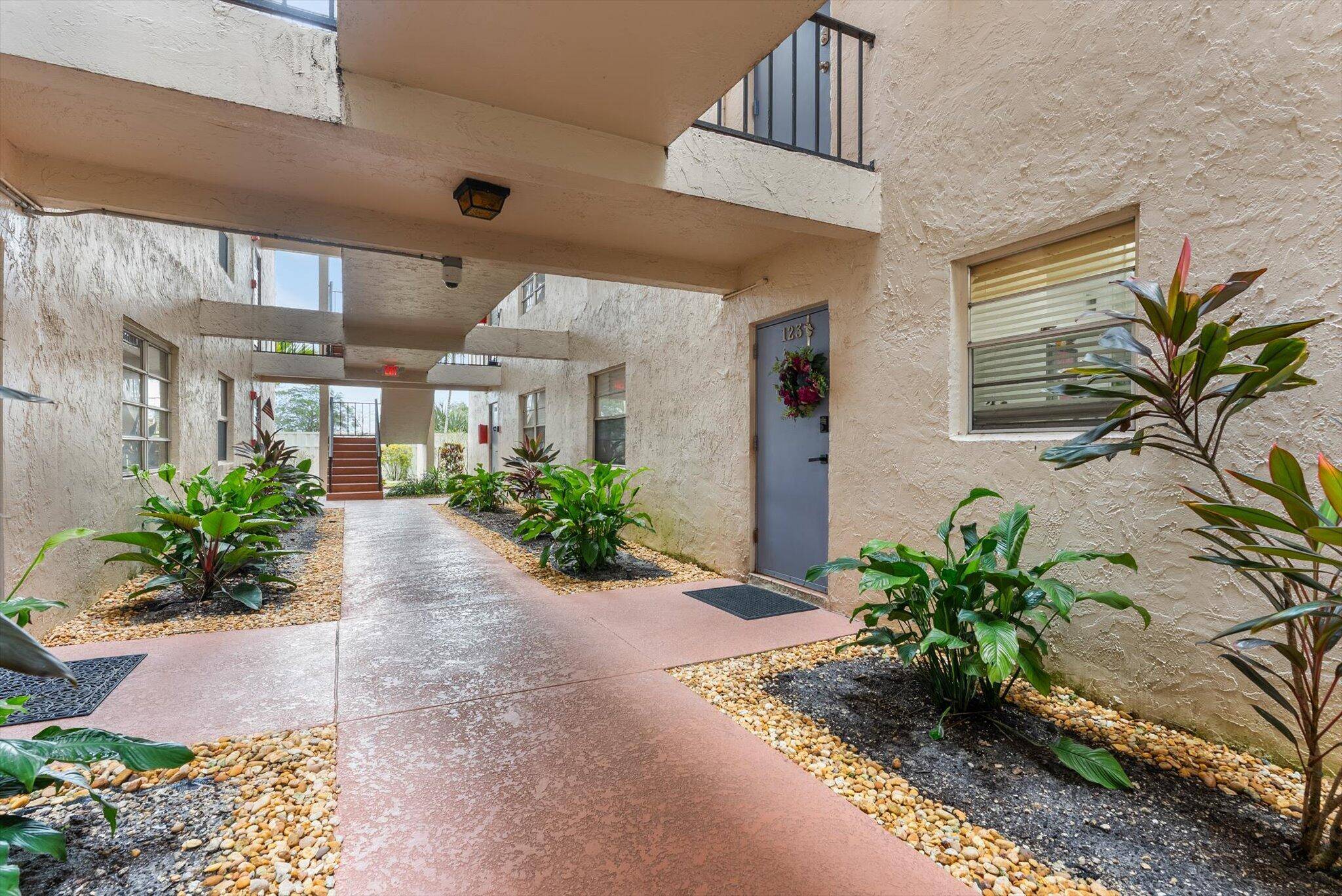 Stunning First Floor Poolside Condo in Sought After 55 Community.