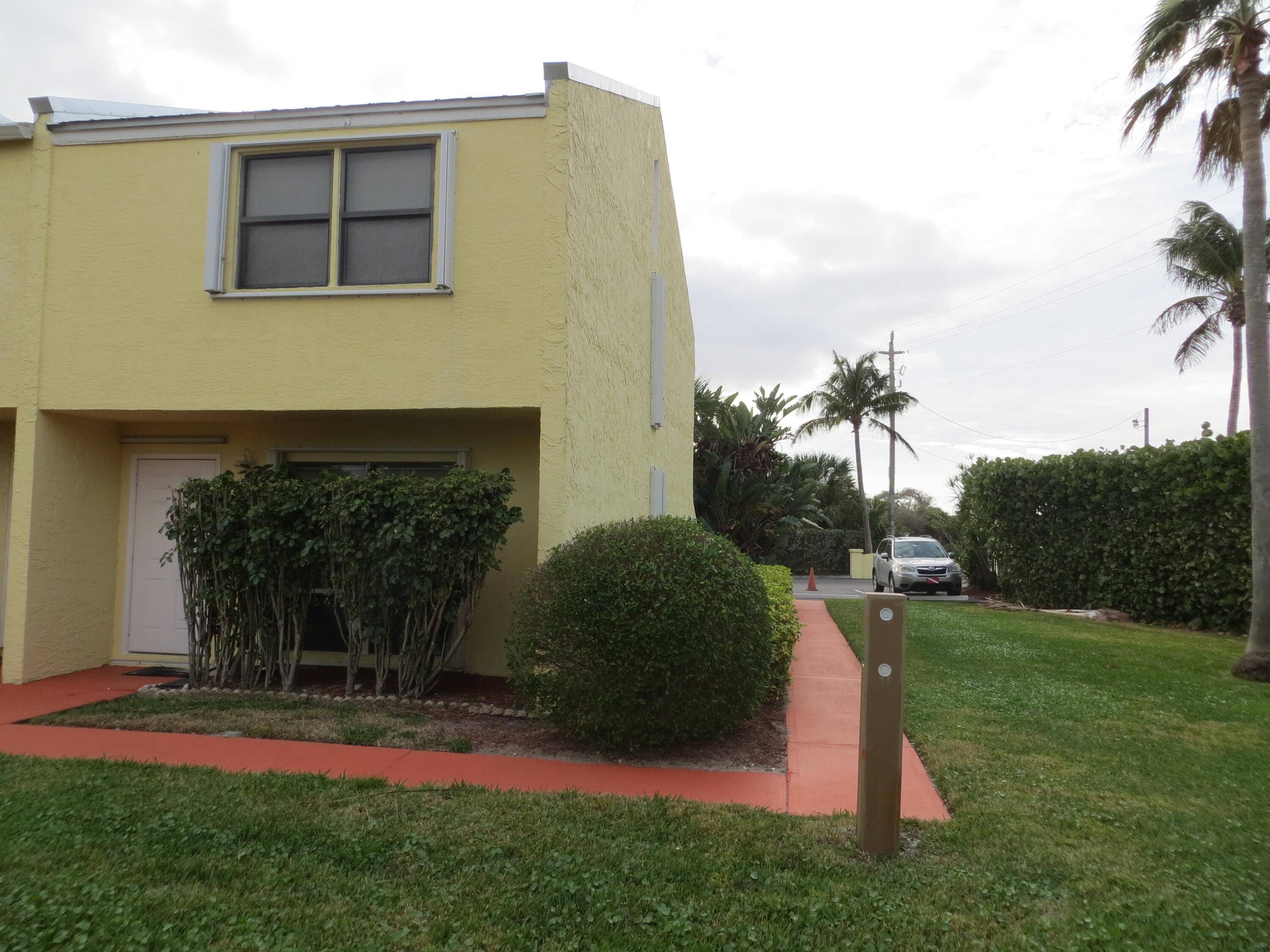 Rarely available end unit in lovely Galleon Townhomes located across the street from the beach.