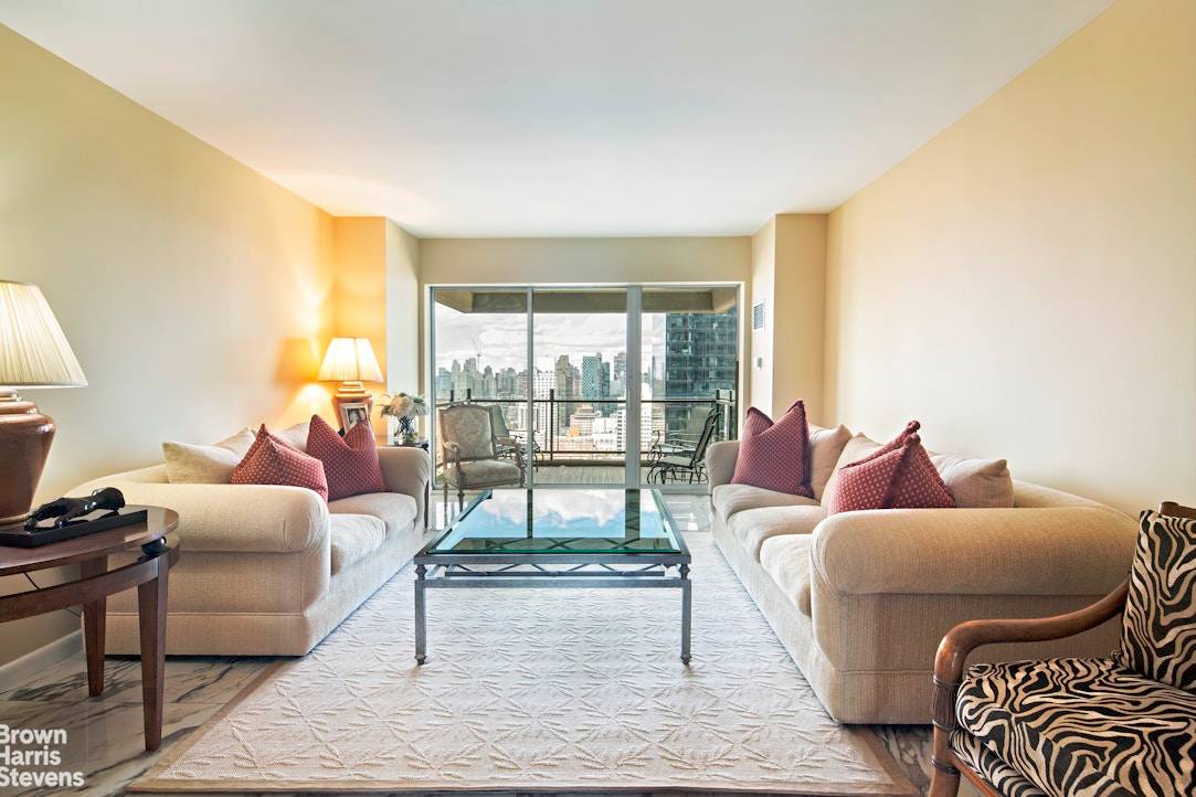Enter this magnificent, light filled home through a marble gallery with a north facing living room and balcony and a south facing formal dining room with views of the city ...