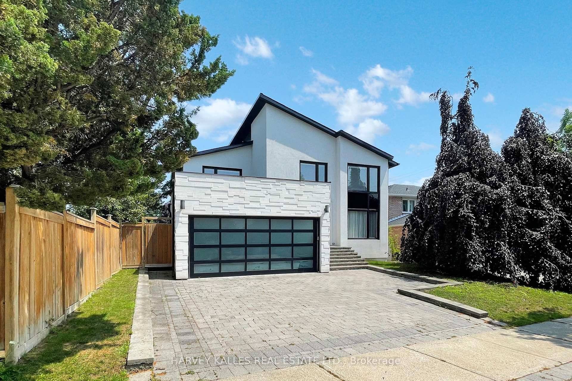 Welcome to this exquisite, custom designed detached residence offering approximately 4, 496 square feet of luxurious living space basement, main floor, second floor nestled in a prime family friendly neighborhood.