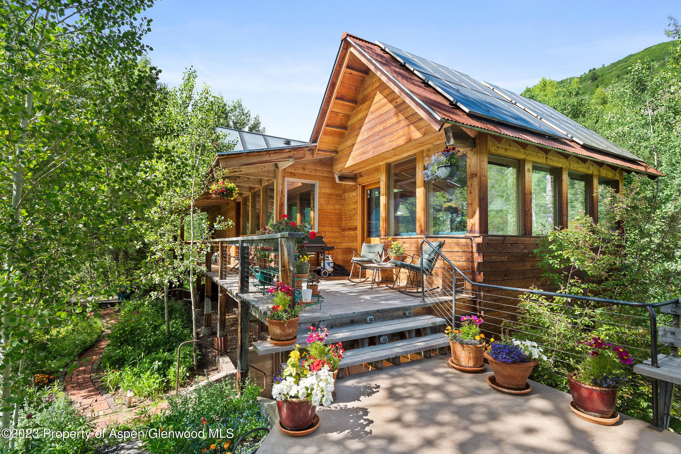This 4 bedroom 2. 5 bath 2936 square foot home on 3 levels sits in the middle of a grove of Aspen trees at the base of Smuggler Mountain.