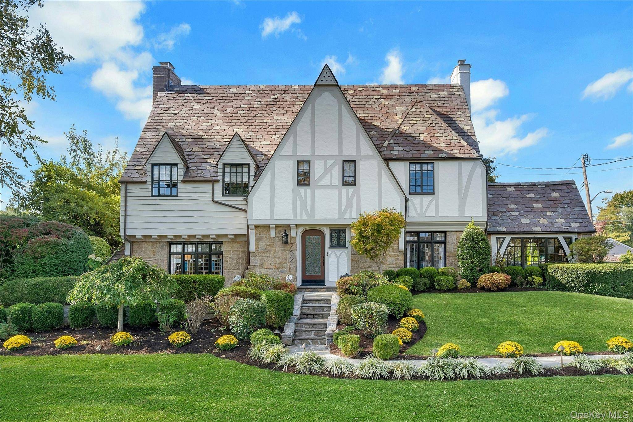 Discover the pinnacle of timeless elegance in this meticulously renovated, sun drenched Tudor, where historic architectural charm seamlessly blends with contemporary sophistication.