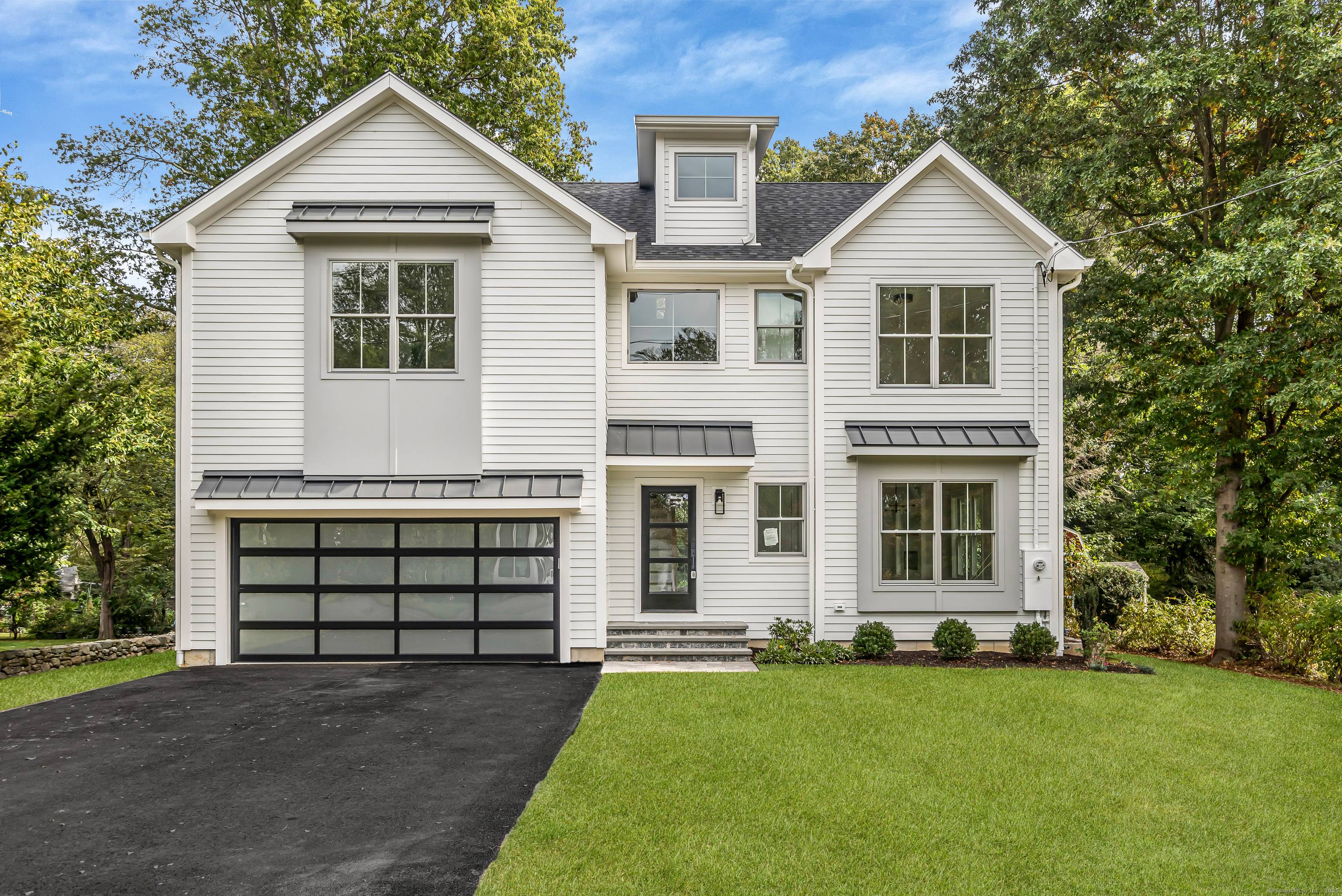 Stunning modern new construction offering high end finishes and sophisticated design throughout.