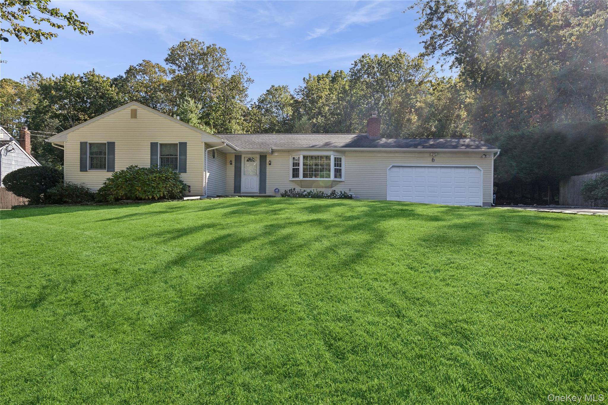 Welcome to this beautifully maintained expanded ranch, ideally situated on a spacious lot set back from the road in the highly sought after Smithtown Pines.