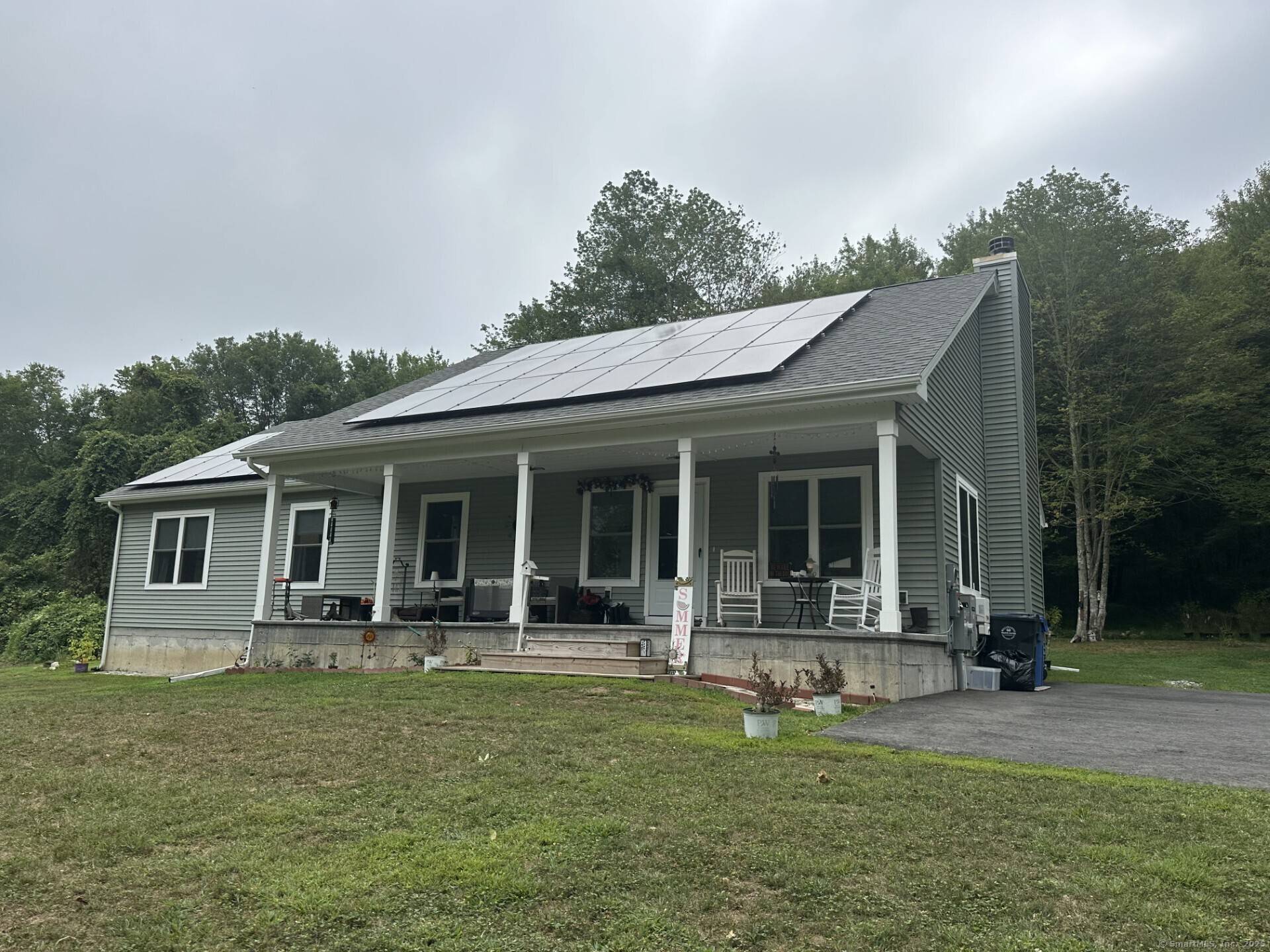 Set on scenic acreage, this inviting single level ranch offers a seamless blend of comfort and natural beauty.