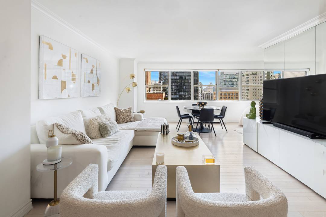 Wake Up to the Sunrise ! This beautifully renovated, chic alcove studio combines style, functionality and exceptional light from a wall of East facing windows.