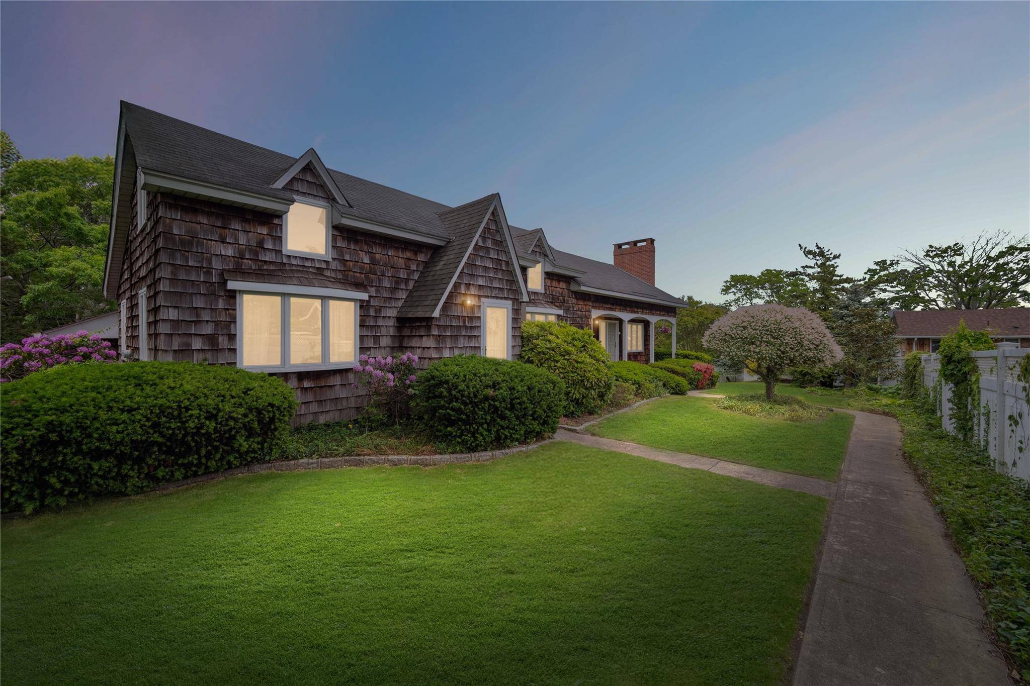 Located in the desirable Democratic Hill area, this 4 bedroom Cape Cod sits on a peaceful 20 acre lake.