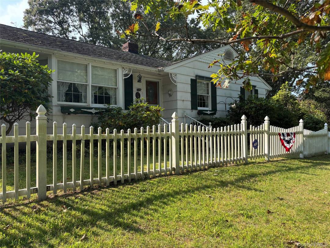 This well maintained corner lot home with a horseshoe gravel driveway, plenty of natural light and great cross ventilation boasts 4 bedrooms with 1.