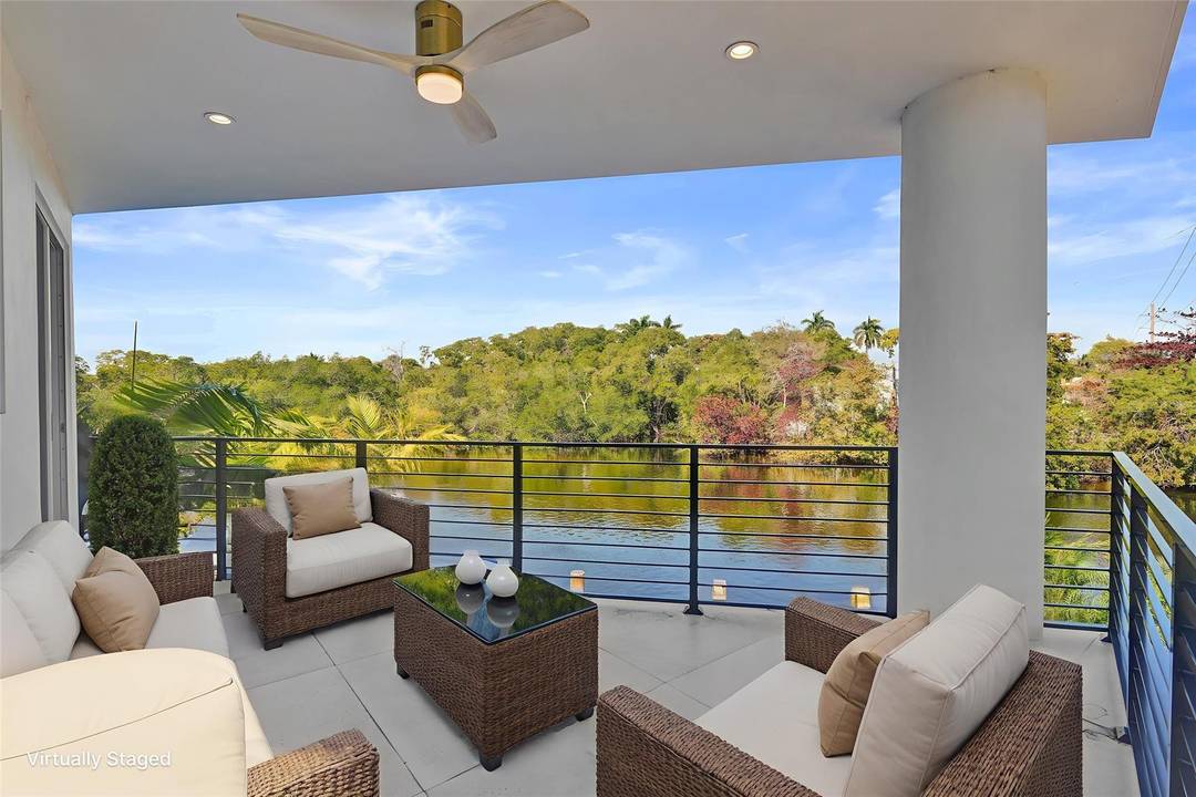EXPERIENCE PEACEFUL VIEWS OF THE MIDDLE RIVER FROM THIS MODERN WATERFRONT LUXURY HOME.