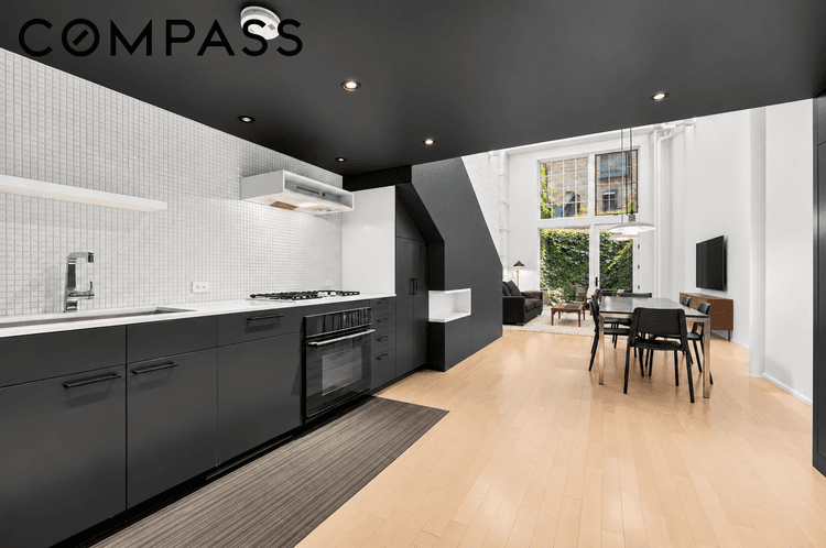 A dramatic, award winning three level loft with two private outdoor spaces in the heart of Greenwich Village.