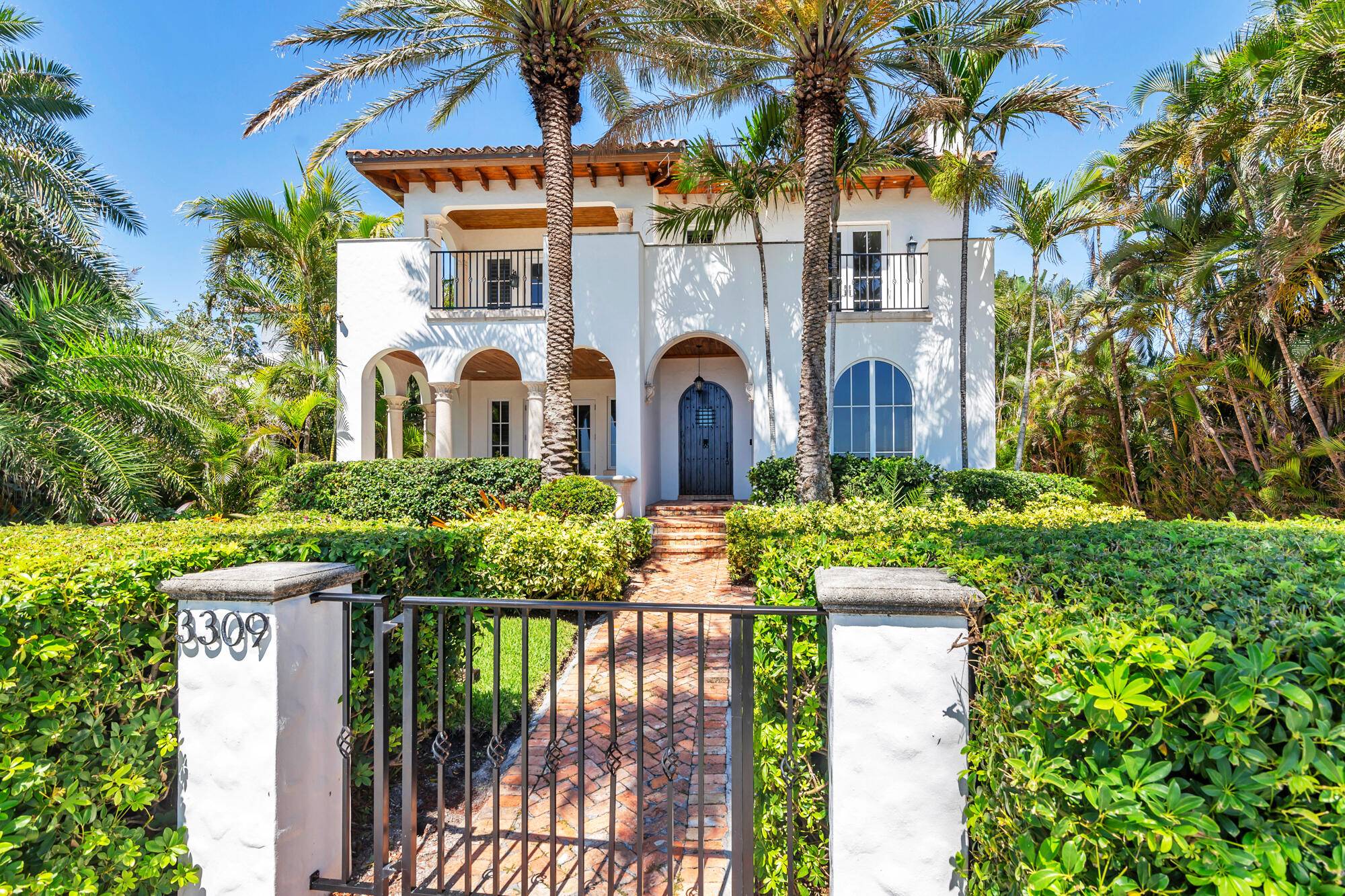 Enjoy over 60 feet of prized Intracoastal waterfront on coveted South Flagler Drive, where you can build your own private dock and soak in breathtaking views of Mar a Lago.