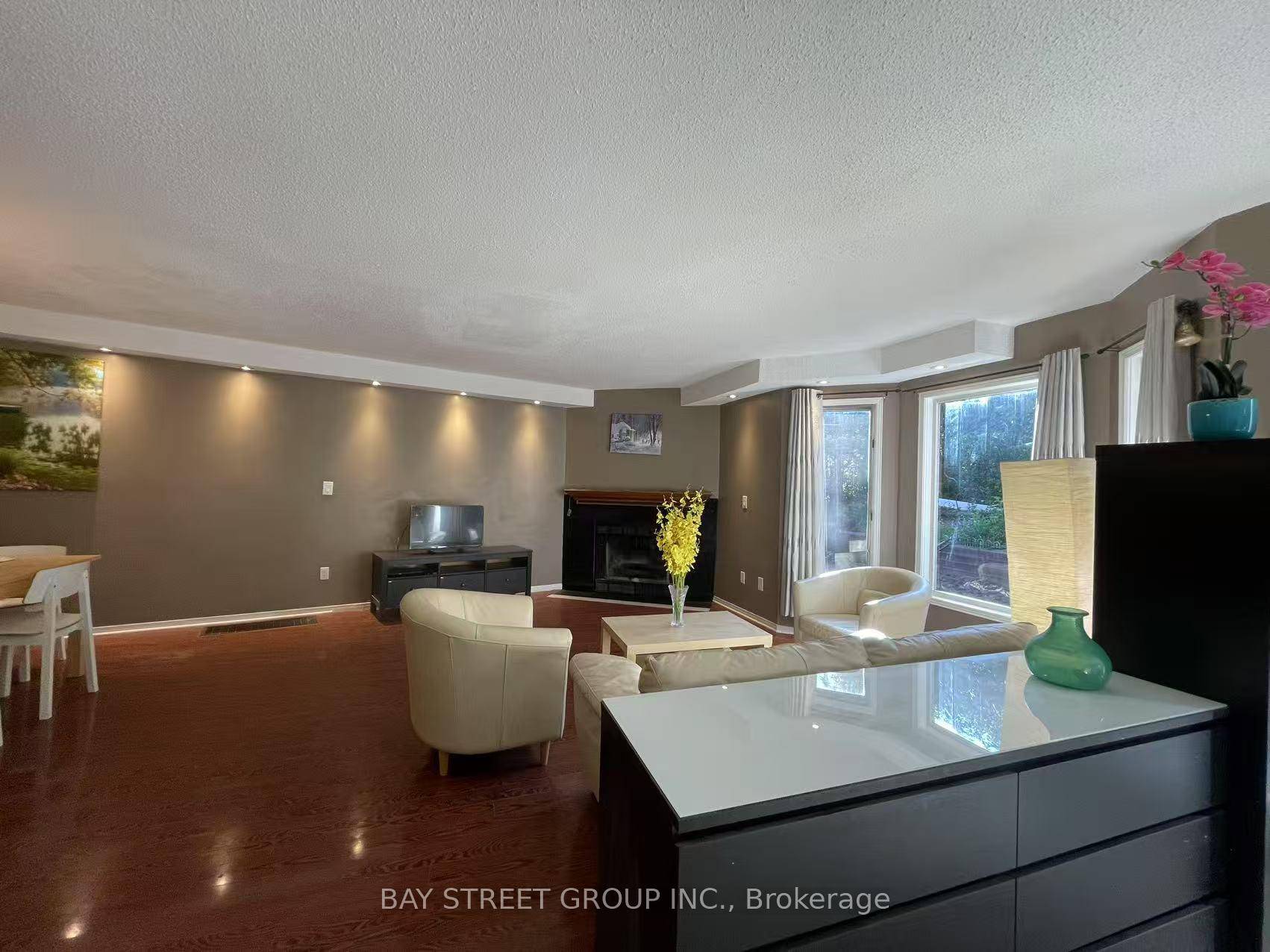 Discover this Rare End Unit Townhouse Backing onto a Wooded Trail in the Heart of Clearview !