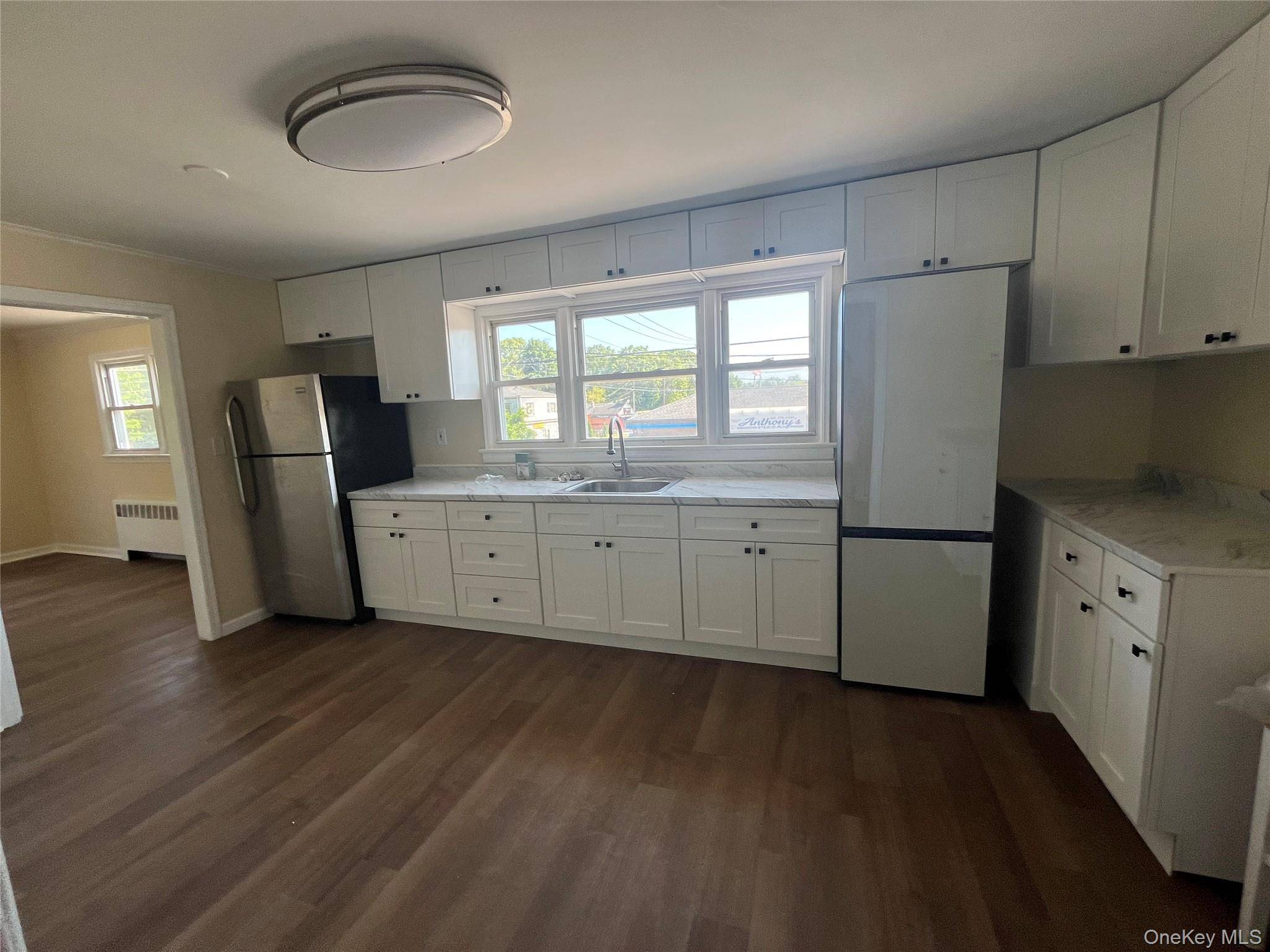 Newly updated and spacious 5 bedroom 2 bathroom 2nd floor apartment above a convenience grocery and deli.