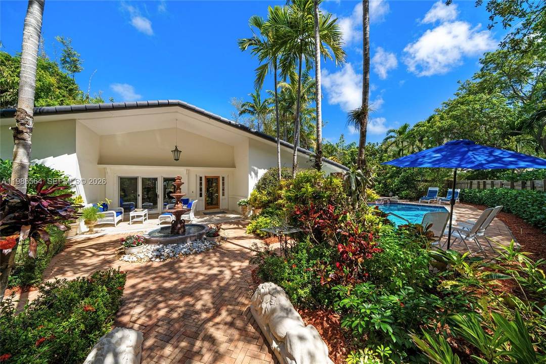 This beautiful villa style residence in Key Biscayne sits on charming Cranwood Drive, a quiet, residential street lined with mature oak trees near the Village entrance.