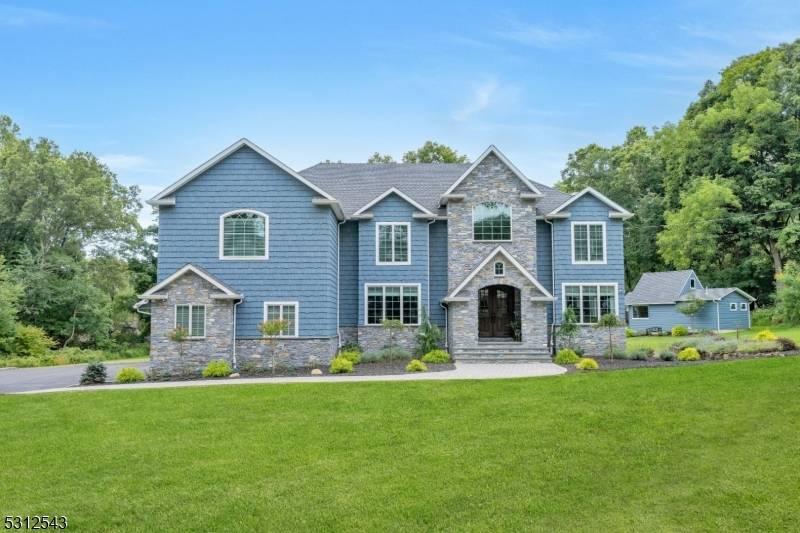Welcome home to this one of a kind custom built home located in one of the most desirable sections of Parsippany.