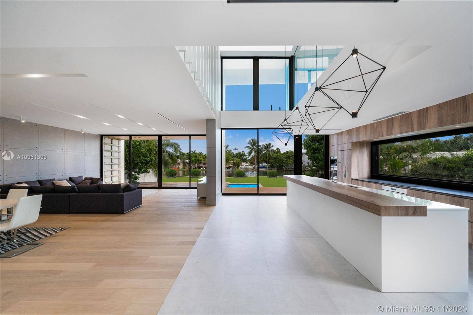 New Construction Modern Masterpiece Located within the serene gated community of Normandy Isle.
