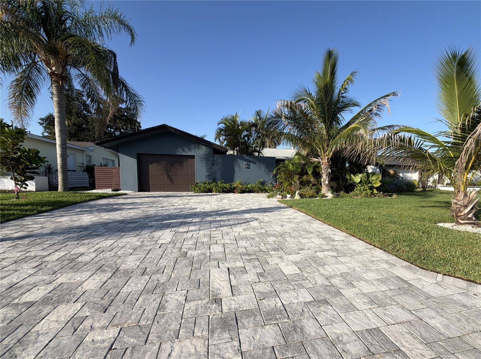 This tastefully upgraded split plan home features a modern, open living area with a Scandinavian style ambiance.