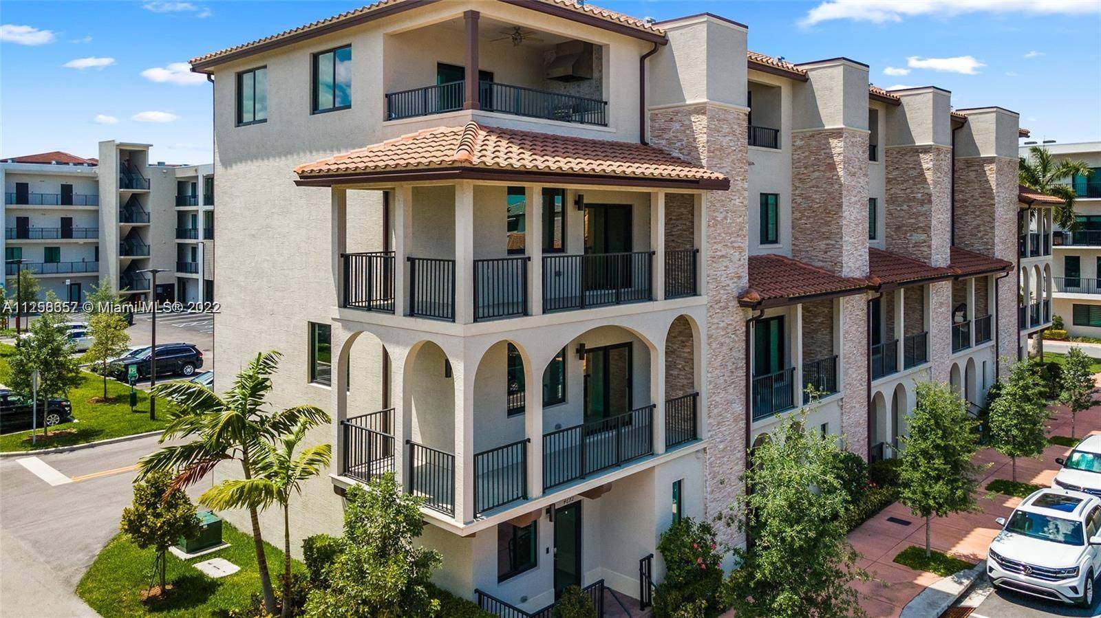 For Sale, this stunning corner 4 story Townhome at URBANA Downtown Doral, near schools, parks, restaurants and shops.