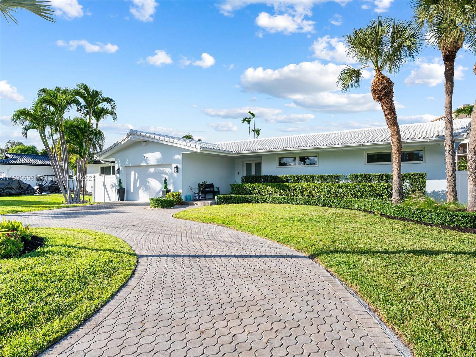 Nestled within the prestigious gated community of Golden Isles Estates, this 3 bedroom 2 bath 2 car garage waterfront home promises a taste of the luxurious Florida lifestyle.