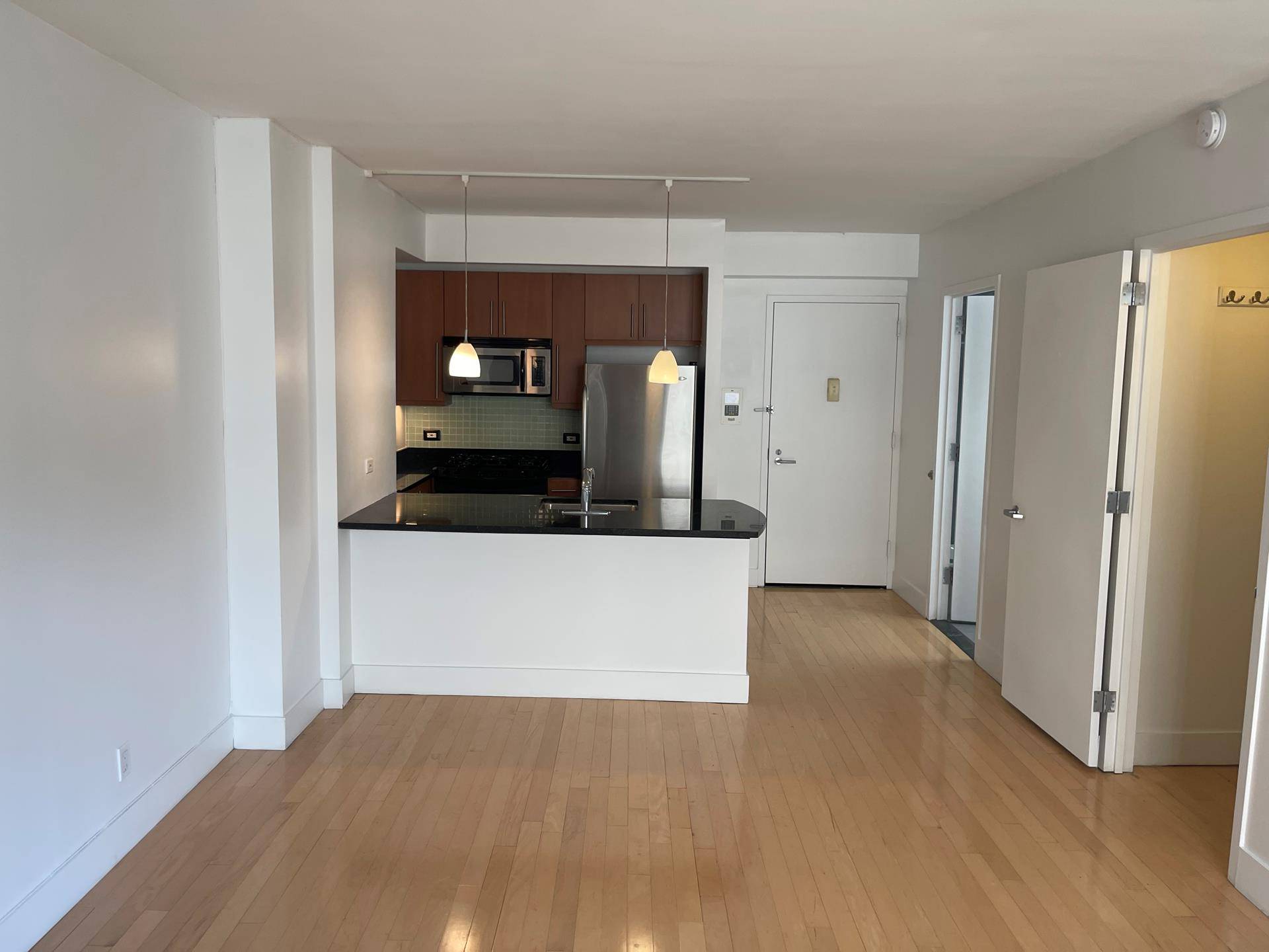 This unit faces a quiet tree lined street and has an view of the Empire State building.