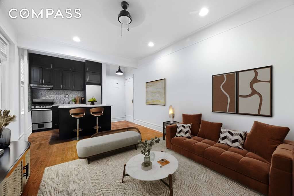 Welcome home to this sunlit top floor gem on a tree lined street in the heart of Turtle Bay.