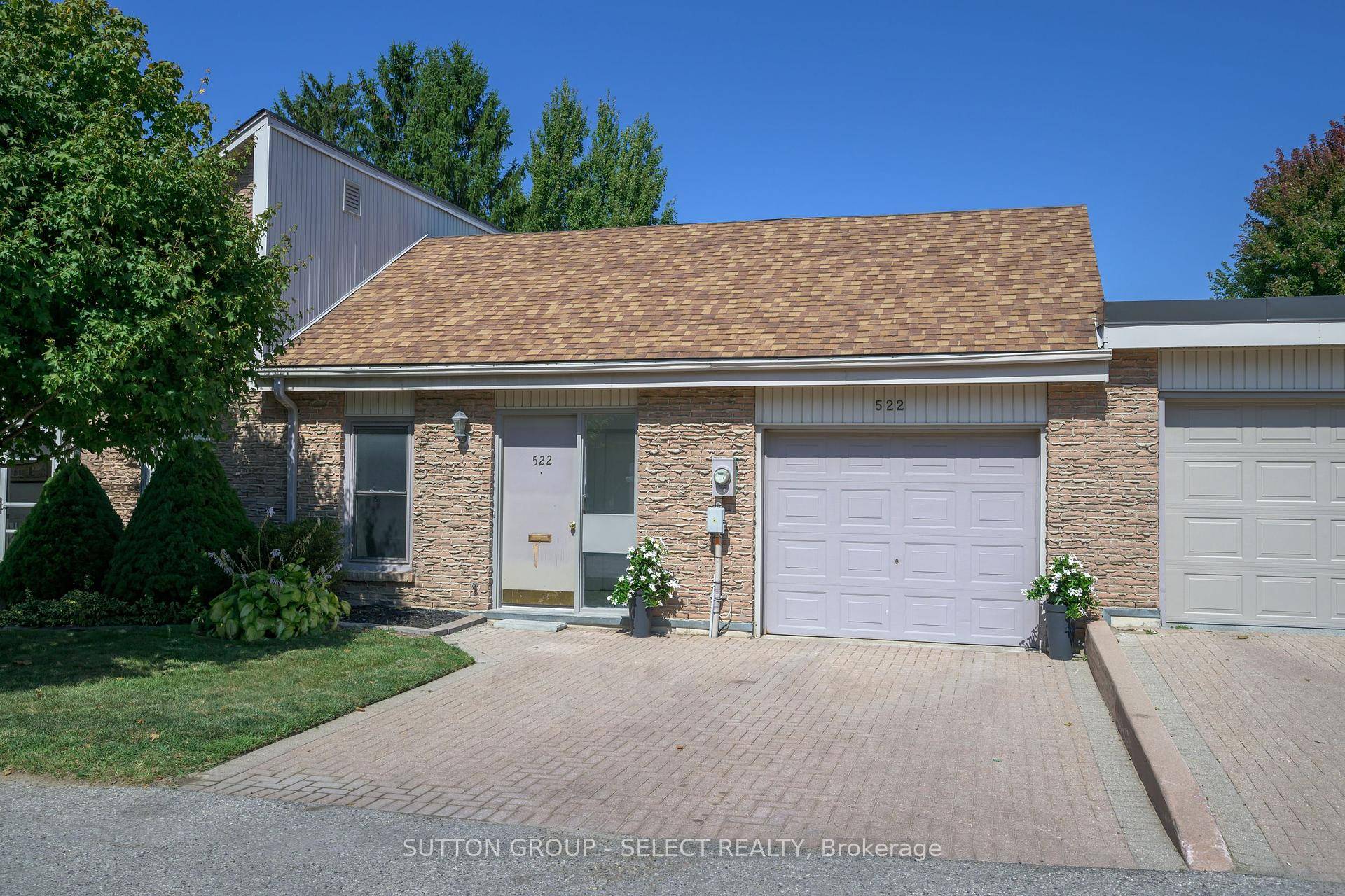Secluded one floor condo living in desirable Old Westmount.