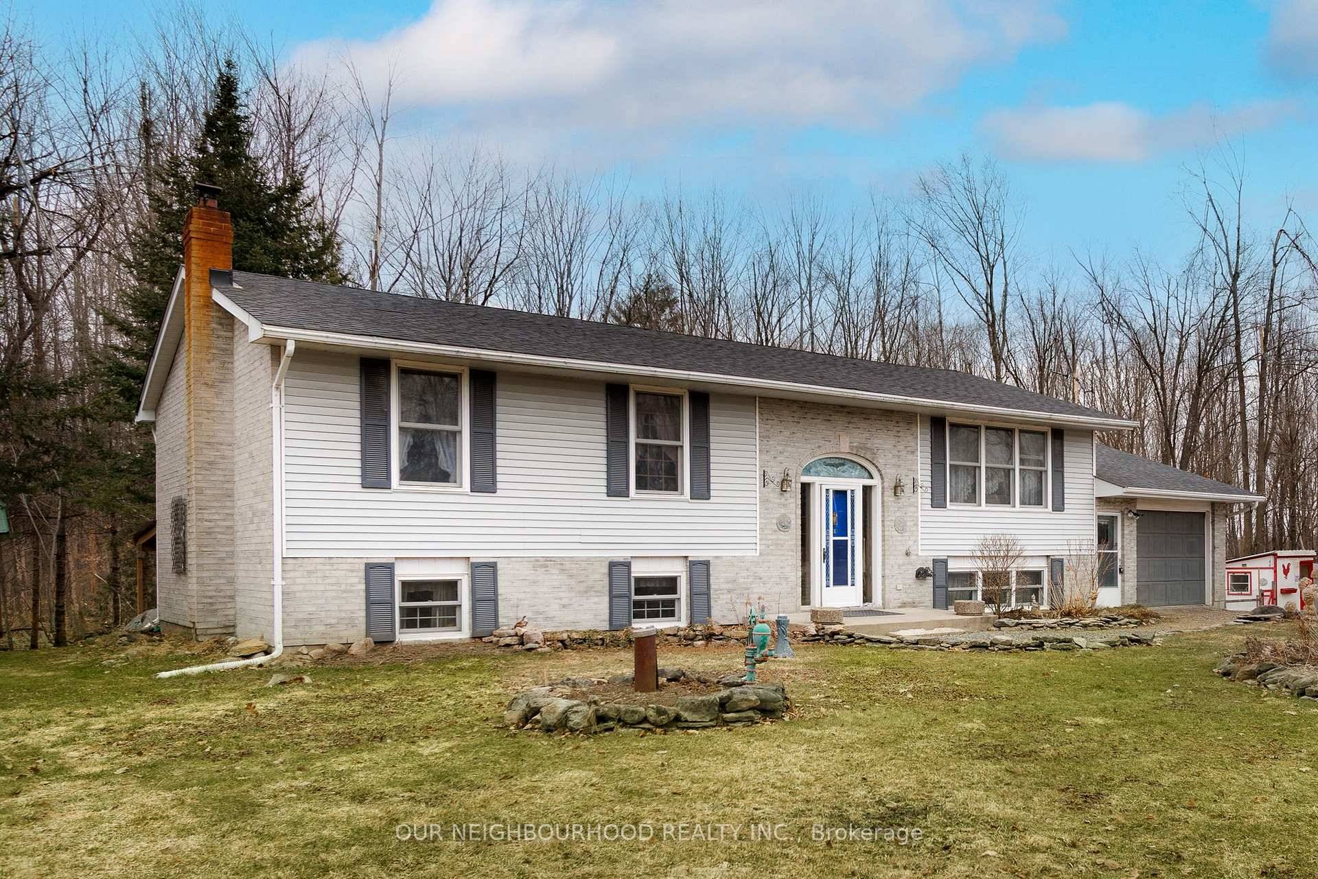 Charming Raised Bungalow on a Picturesque Treed Lot !