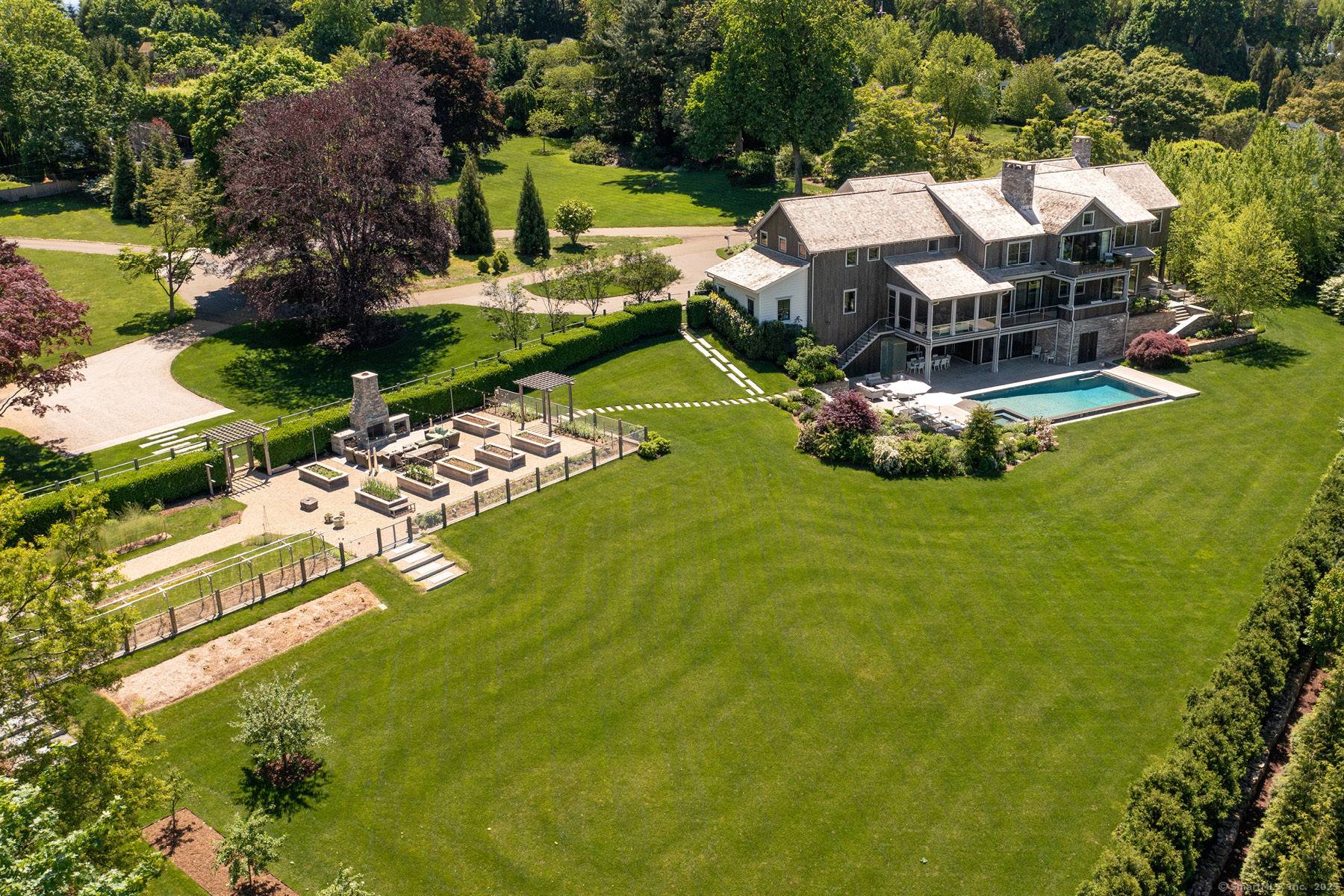 Welcome to your dream home on Westport's premier Compo Beach cul de sac an extraordinary 2 acre estate offering privacy, luxury, and resort style living in one of Fairfield County's ...
